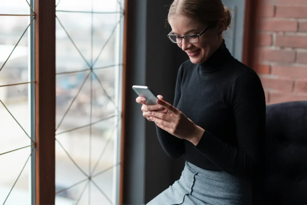 Smiley Woman Using Phone