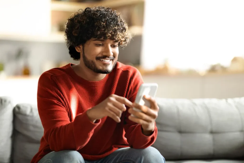 Smiling Indian Man Smartphone