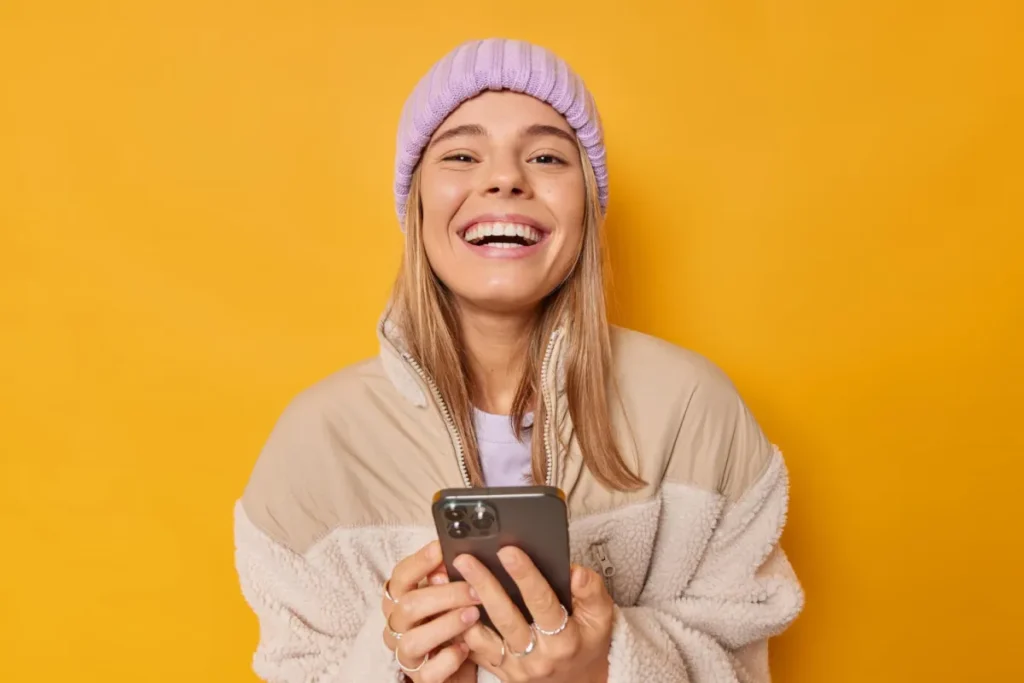 smiling girl against yellow background